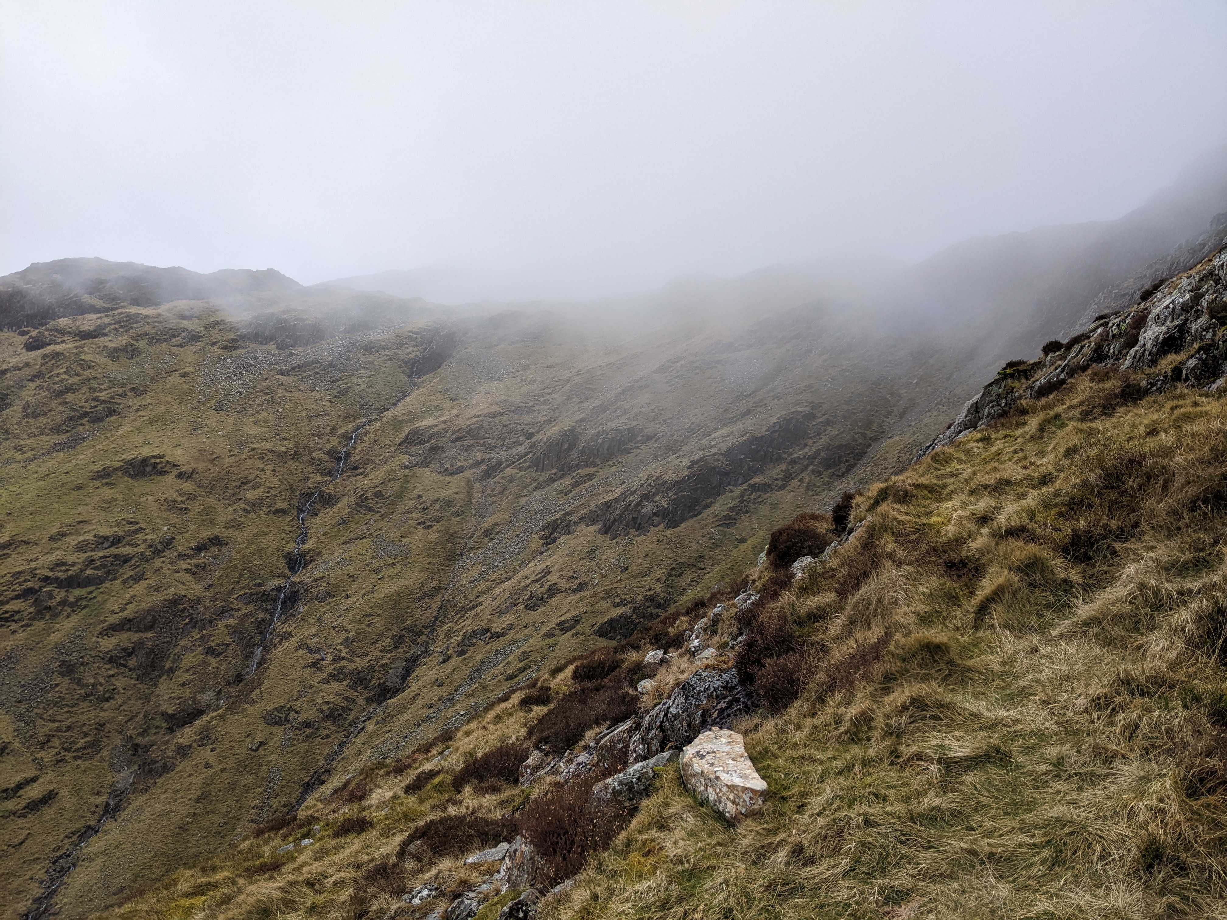 Cloud rolling in on the summit of Cam Crag
