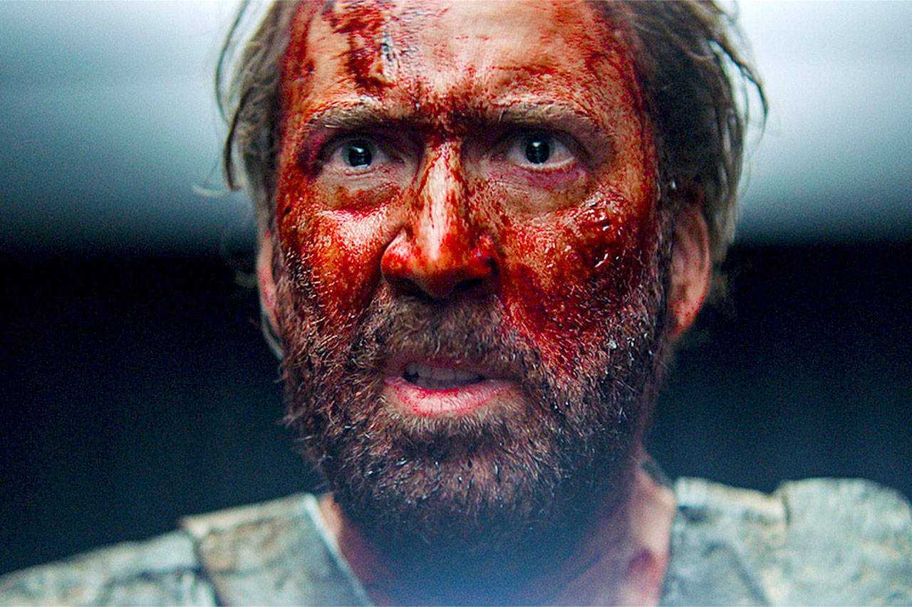 Nicholas Cage with blood on his face